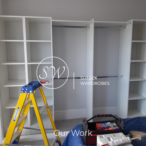 A fitted wardrobe during the installation process